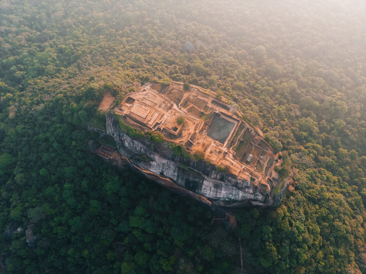 Aerial view of Sigiriya rock fortress rising above surrounding jungle, Sri Lanka