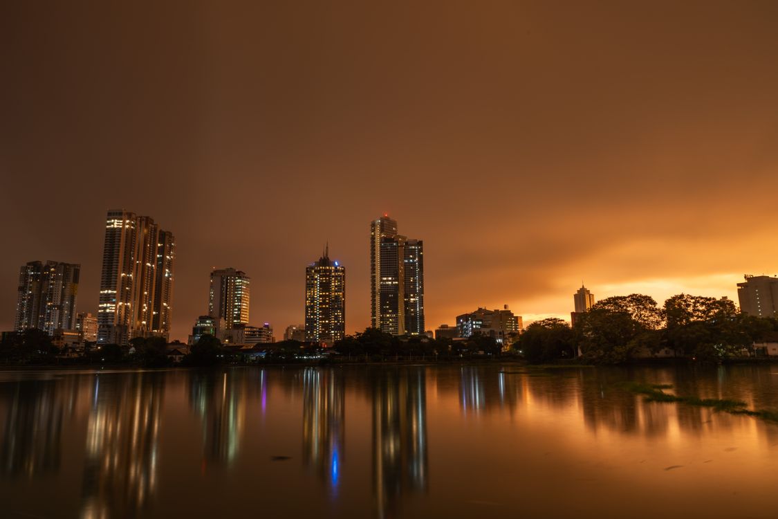 Colombo city skyline with high-rise buildings and the Beira Lake visible in the foreground