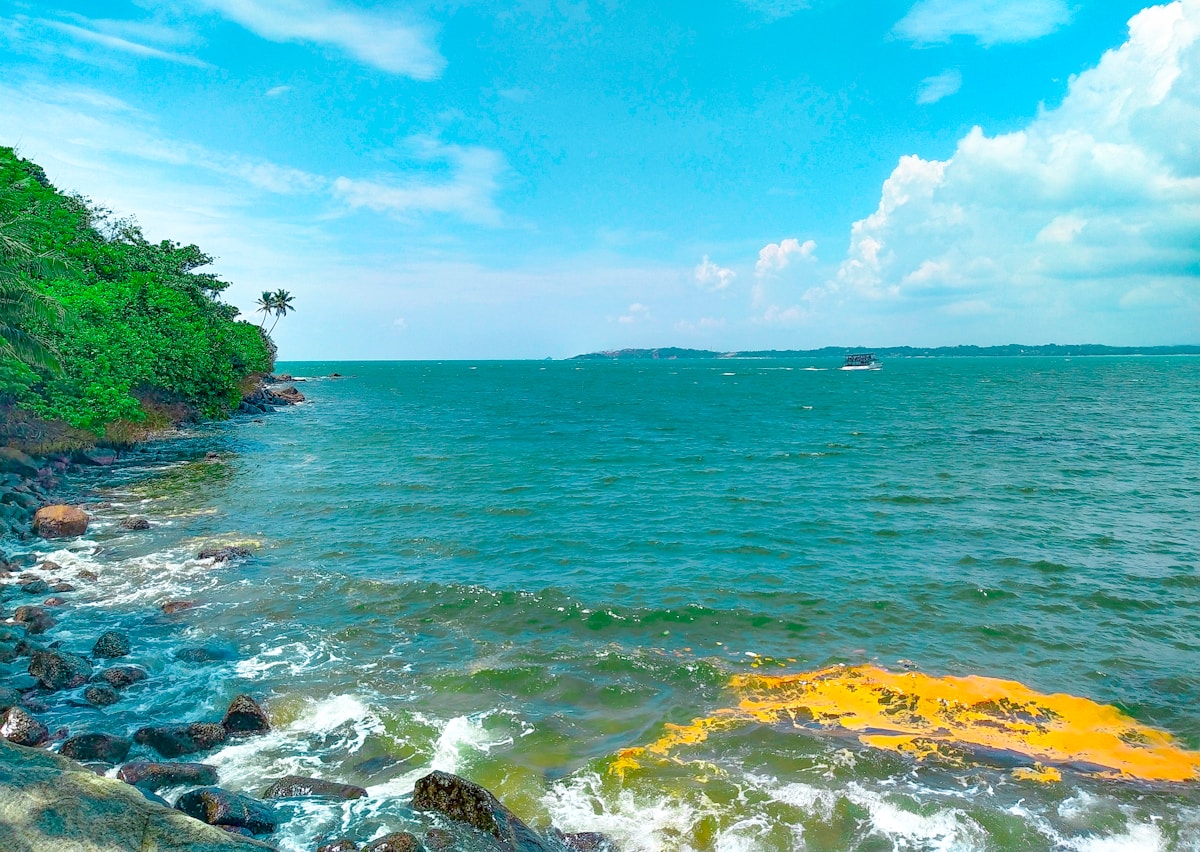 Rocky tropical coastline with turquoise water on Sri Lanka's east coast