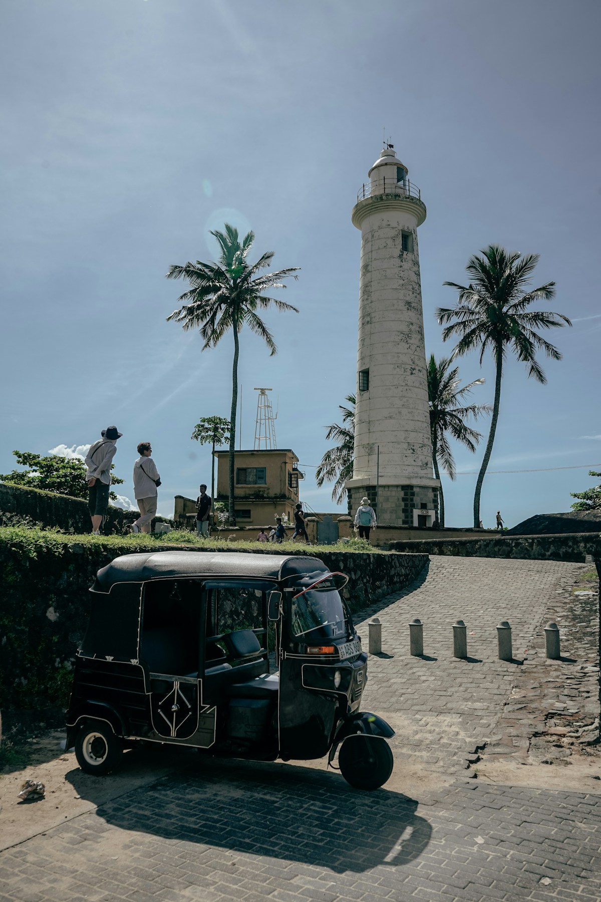 Tuk-tuk parked at Galle Fort lighthouse, Sri Lanka