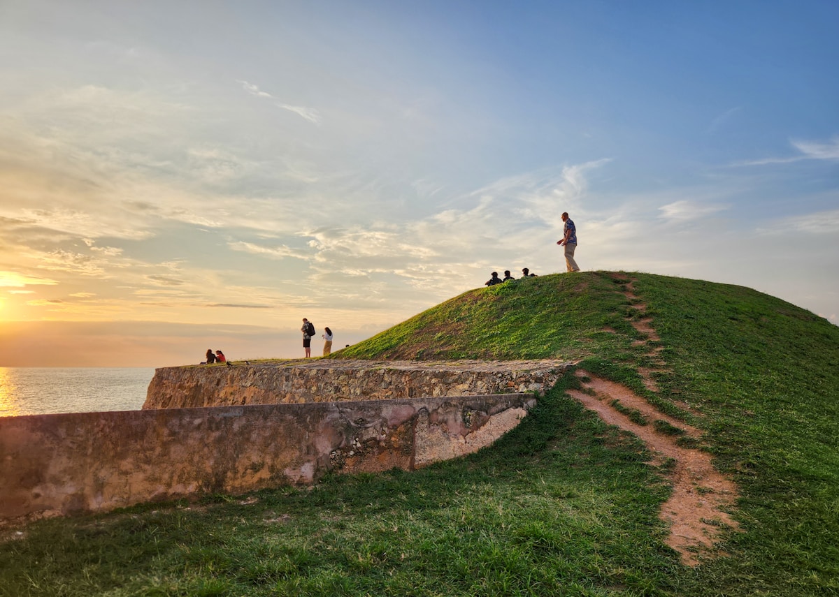 Visitors watching sunset from Galle Fort ramparts, Sri Lanka