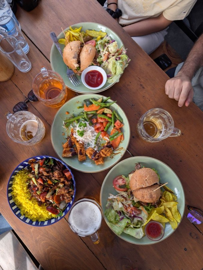 Sri Lankan dishes and drinks on an outdoor restaurant table