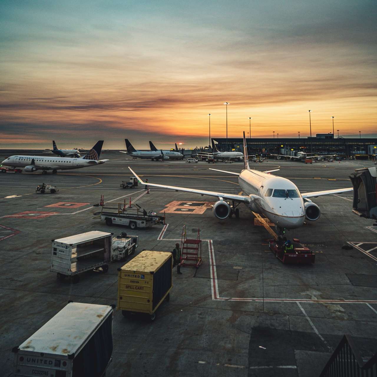 Airplanes at airport terminal at sunset - Jetstar launches first low-cost Australia Sri Lanka direct