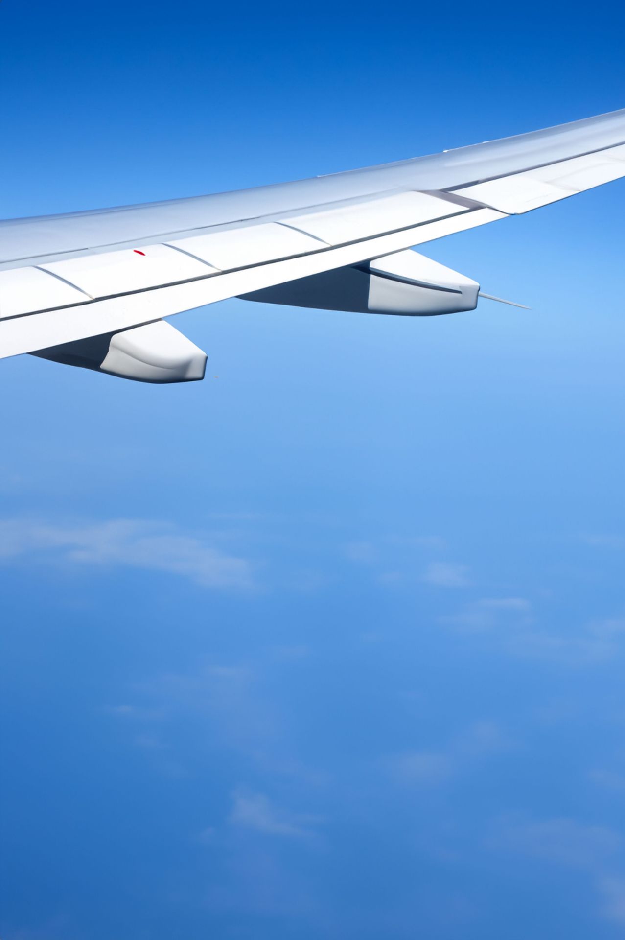 Airplane wing view in daylight — Beijing Capital Airlines Colombo service September 2026