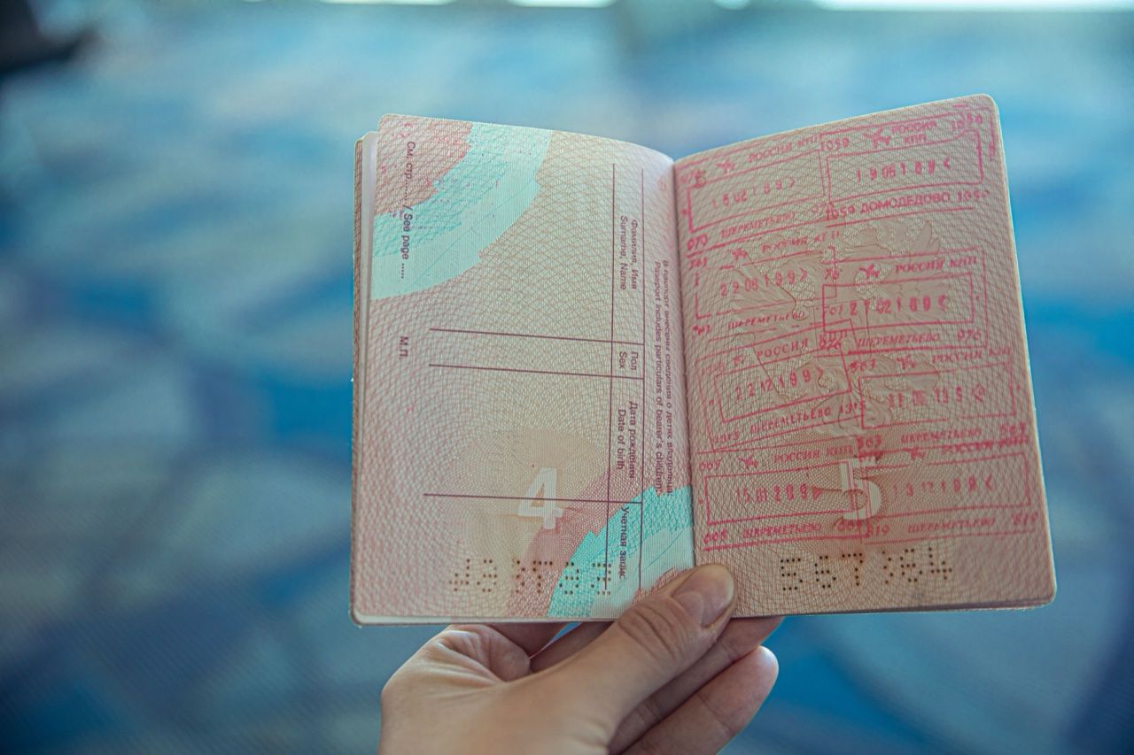 Open passport with travel stamps - Sri Lanka ETA moves to online-only system August 2026
