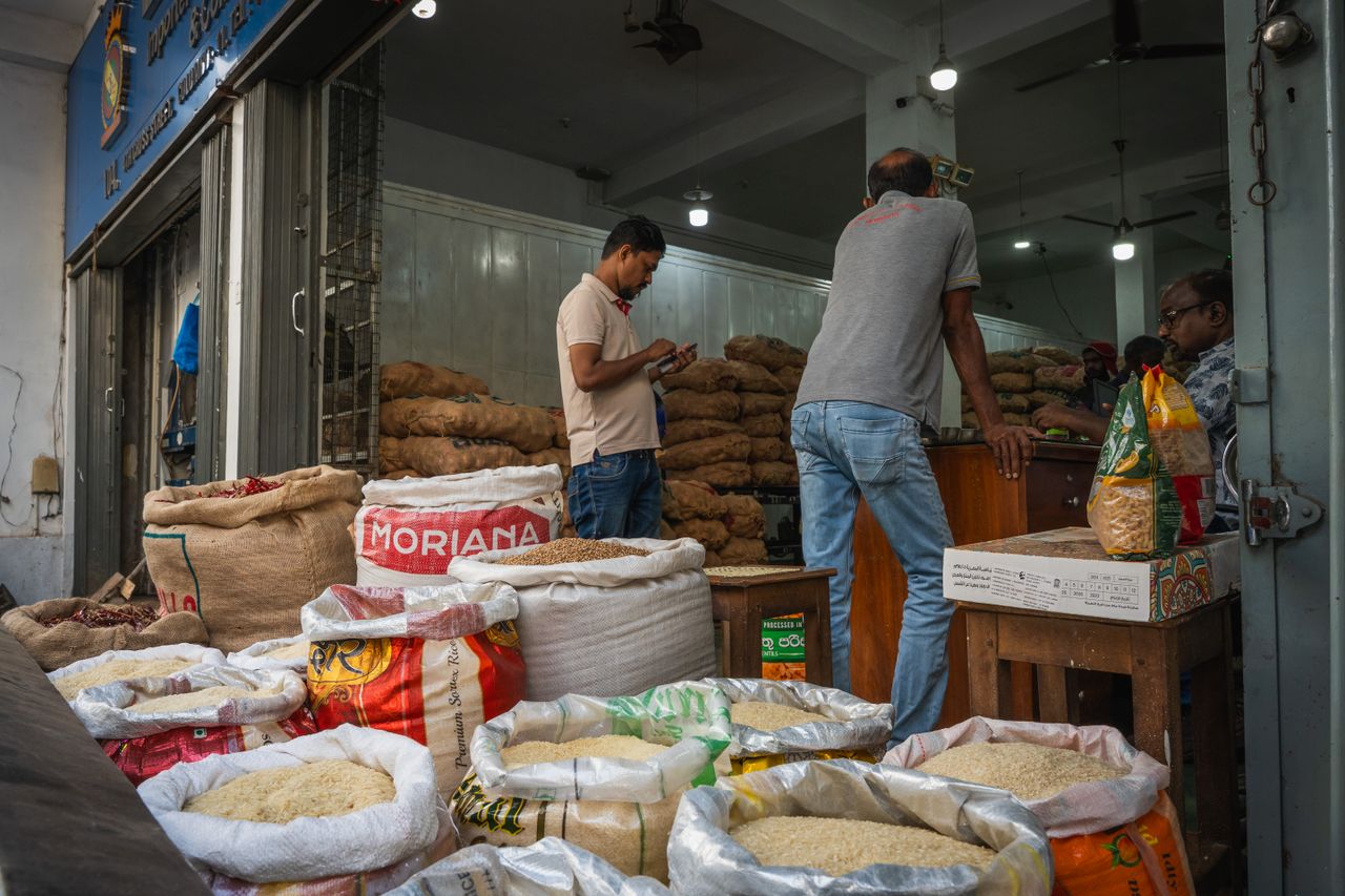Rice sacks and vendors at Pettah market, Colombo