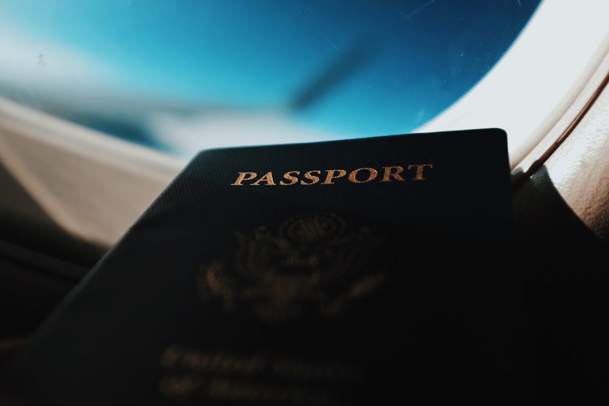 Passport resting against airplane window — Sri Lanka visa and ETA guide