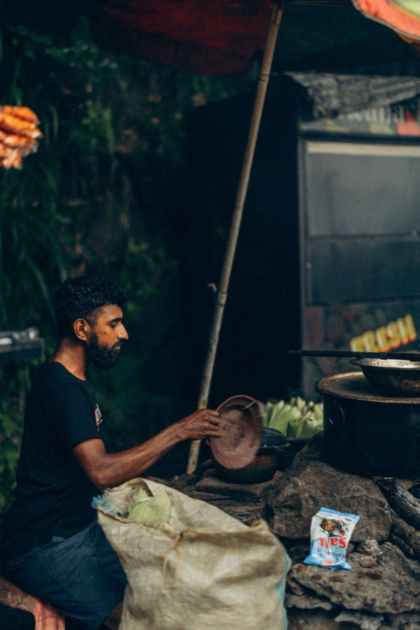Street food vendor at stall, Sri Lanka - Sigiriya food guide