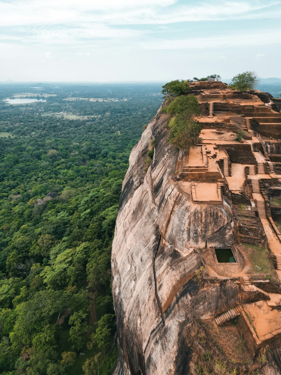 View of cliff with ancient building on top, Sigiriya, Sri Lanka
