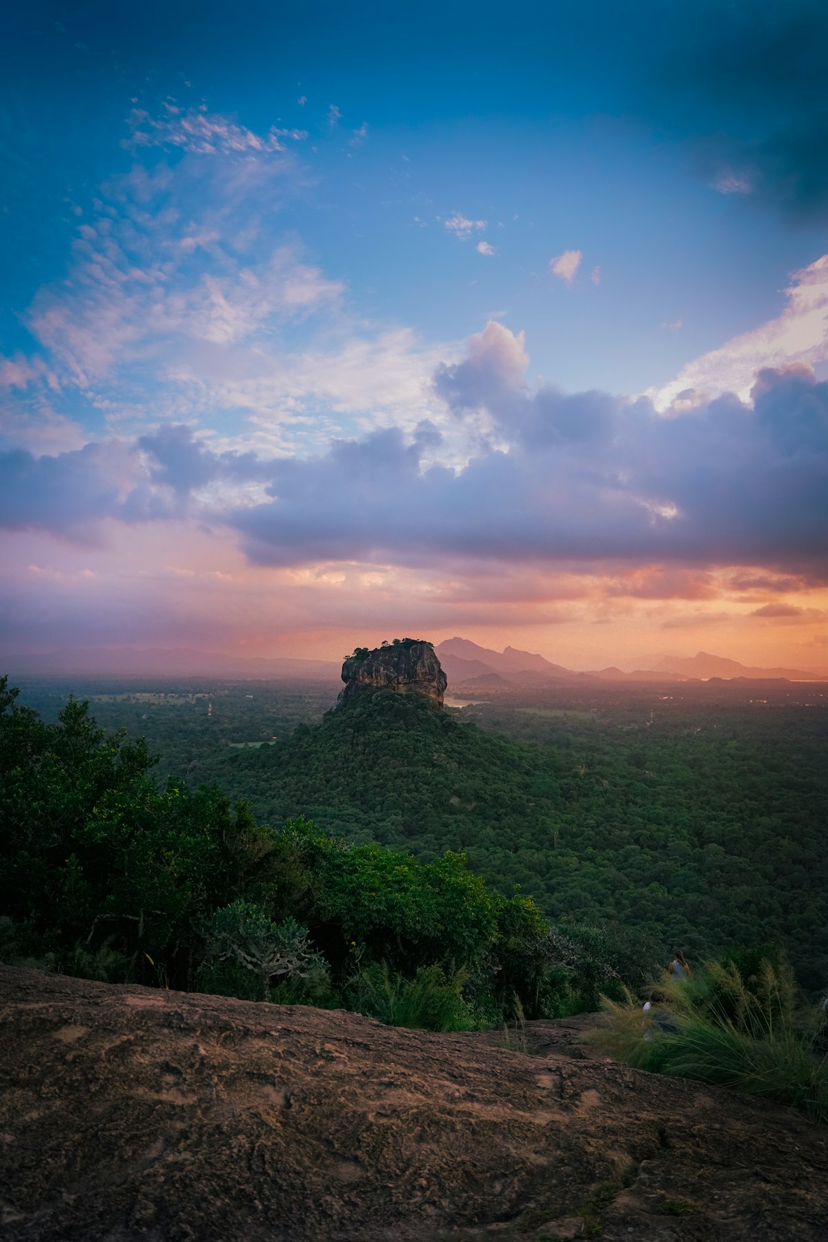 Sigiriya rock fortress rising above the jungle at sunset, Sri Lanka