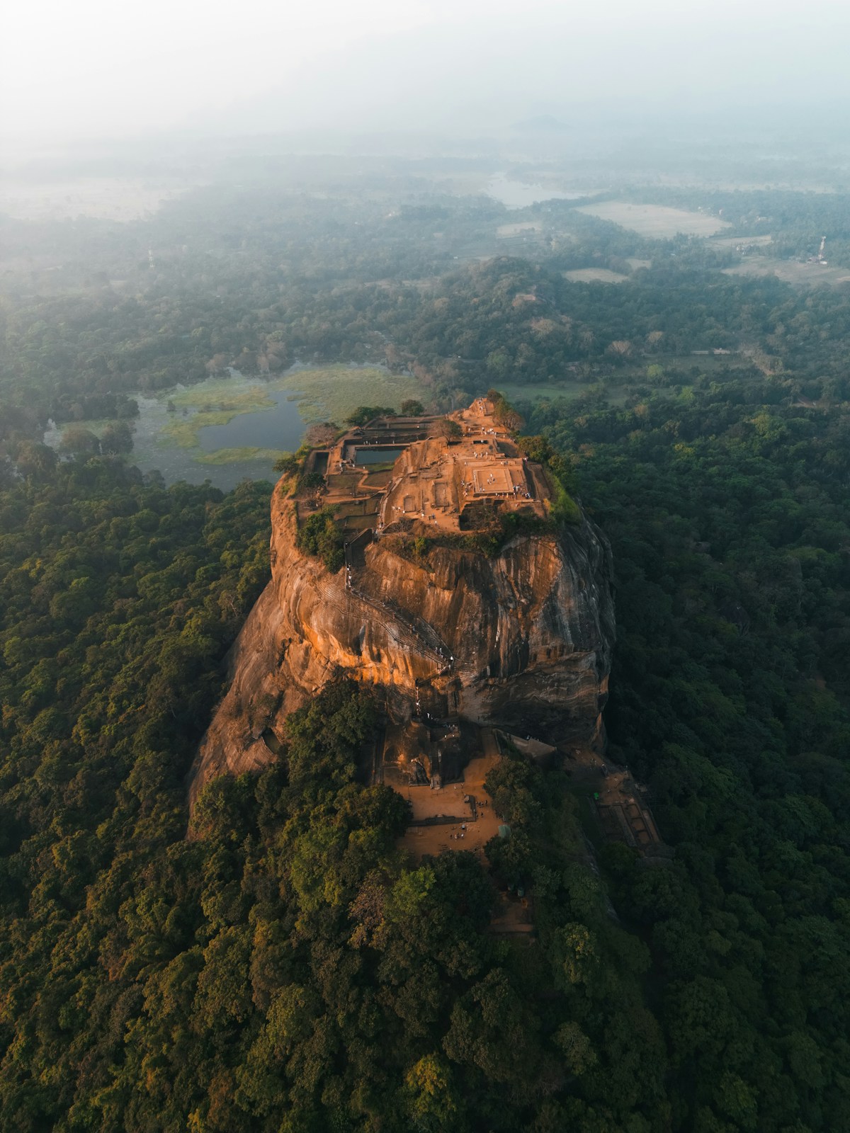 Aerial view of Sigiriya Lion Rock rising above forest, Sri Lanka