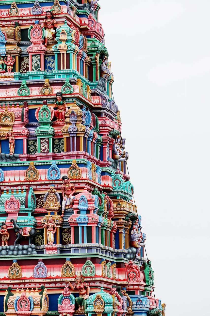 Colourful gopuram of Meenakshi Amman Temple against blue sky, Madurai, Tamil Nadu, South India