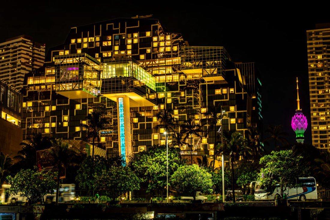 Illuminated Colombo skyline at night with the pink Lotus Tower glowing