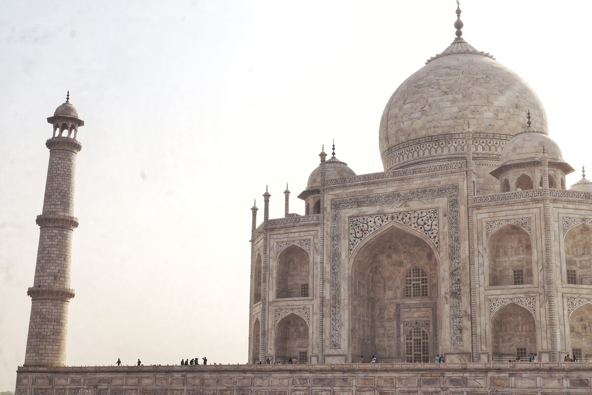 Taj Mahal reflected in a serene pond with lush gardens, Agra, India