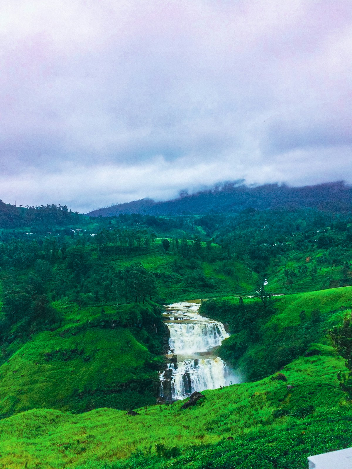 Hikers on the ridge trail near Ella Rock with panoramic views of Sri Lanka's hill country