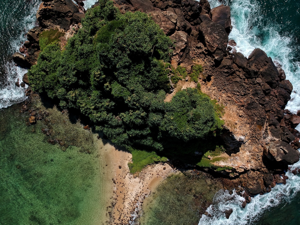Aerial view of a tropical island surrounded by turquoise ocean, Sri Lanka east coast